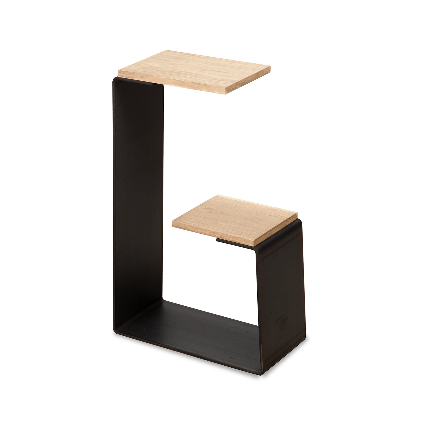 G Table by Vermont Woods Studios with a black metal "C" frame and two staggered light hardwood shelves, showcasing modern craftsmanship and functional design.