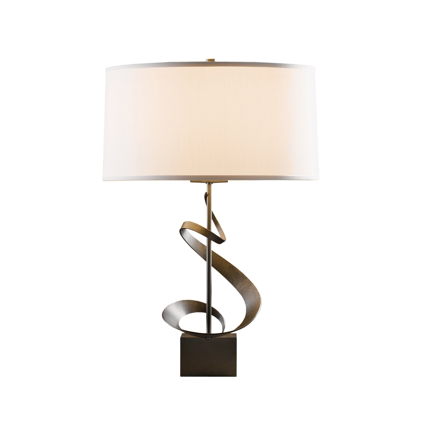Hubbardton Forge Spiral Table Lamp with white cylindrical shade and metal base showcasing a detailed spiral design on a square foundation.