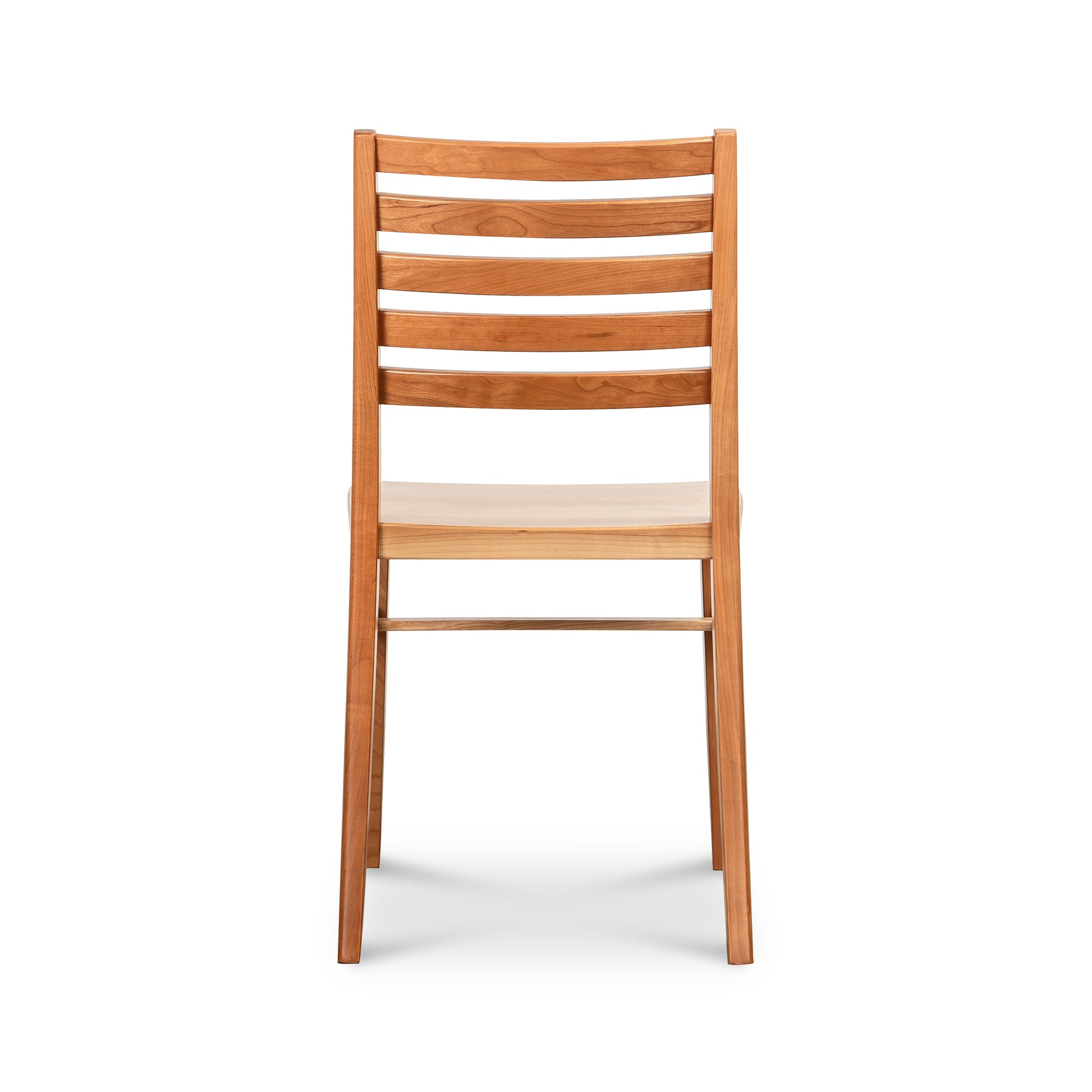 Grafton Chair floor model by Vermont Woods Studios, crafted in natural cherry, features a slatted backrest and quality American craftsmanship.