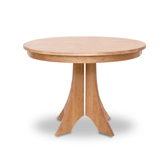 Hampton Split Pedestal Round Table by Lyndon Furniture showcasing a smooth solid wood top and sturdy four-legged base.