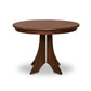 A sturdy Hampton Split Pedestal Round Table with a wooden base by Lyndon Furniture.