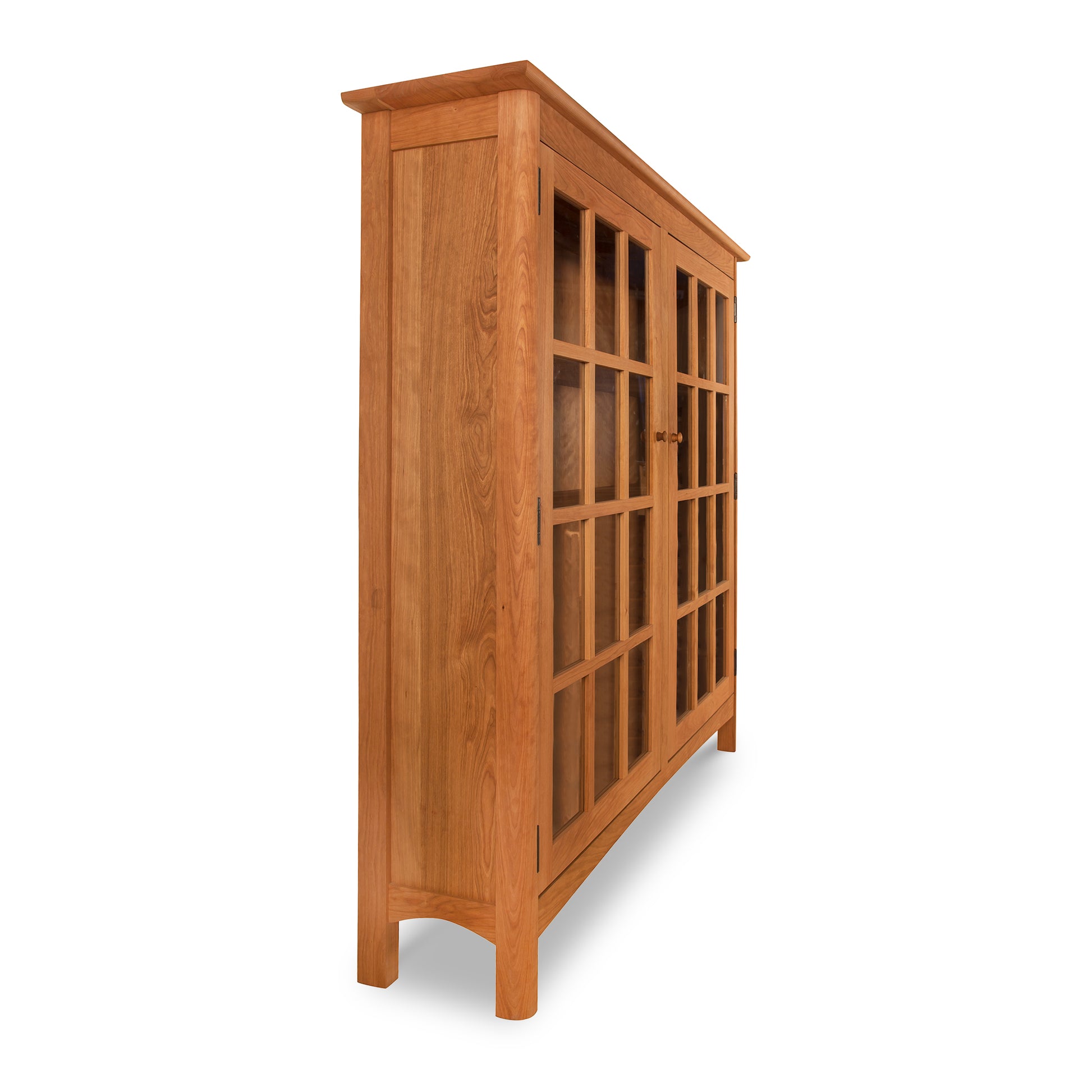 A Heartwood Shaker 2-Glass Door Bookcase by Vermont Furniture Designs with glass doors on a white background.