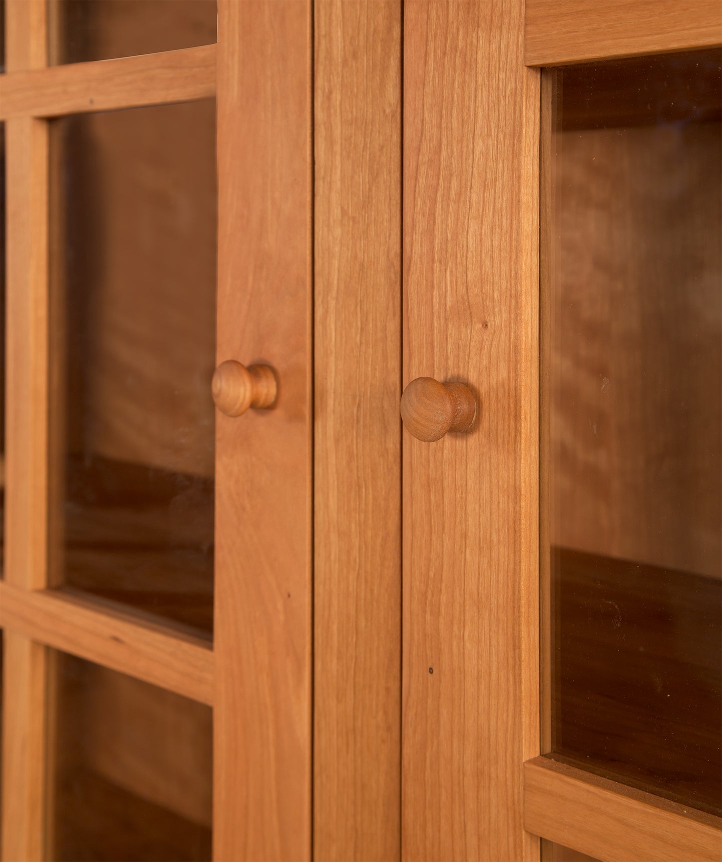 Heartwood Shaker 2-Glass Door Bookcase by Vermont Furniture Designs, showcasing solid wood construction, classic wooden knobs, and clear glass door panels.
