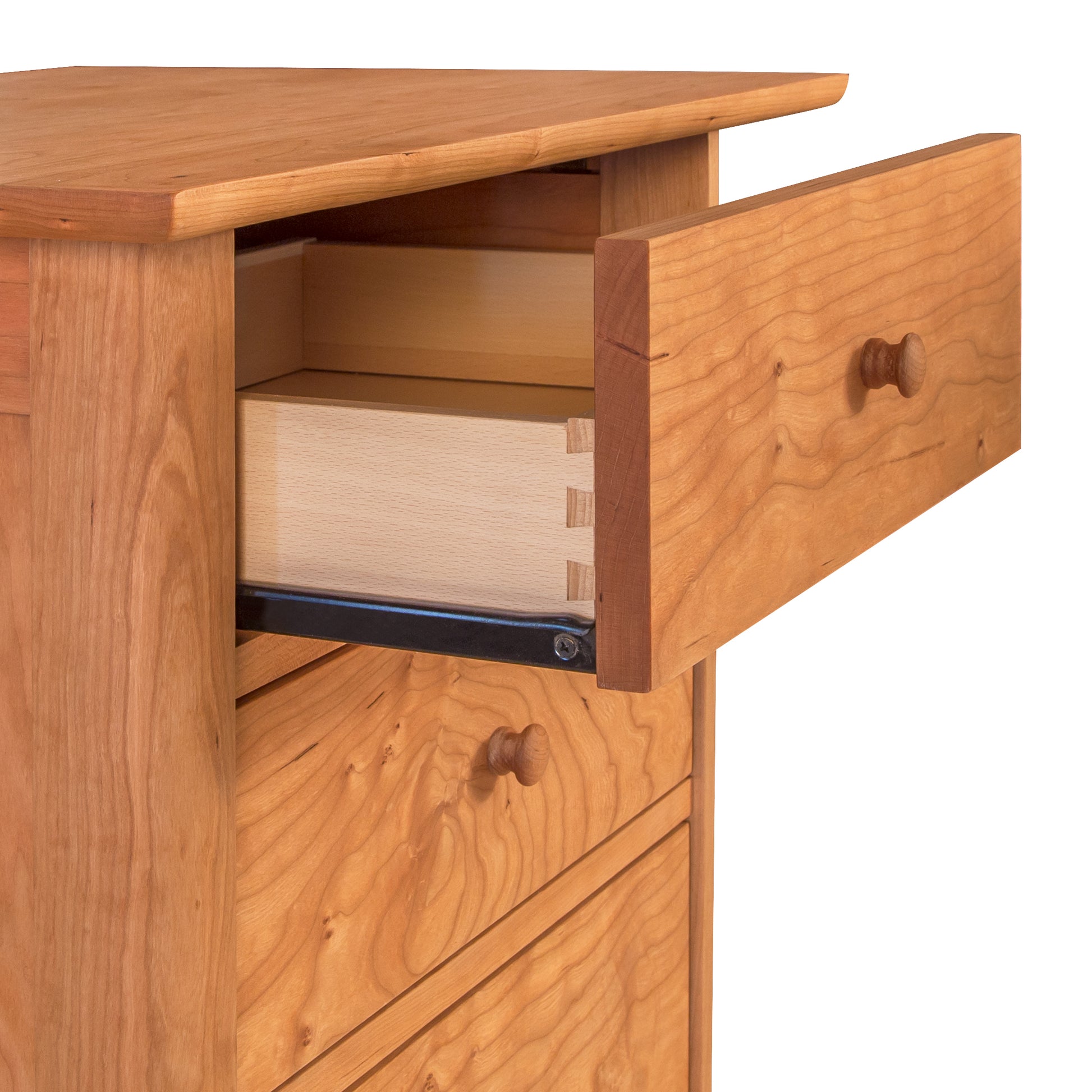 A Vermont Furniture Designs Heartwood Shaker 3-Drawer Nightstand with an open drawer, showcasing its construction and metal sliding mechanism.