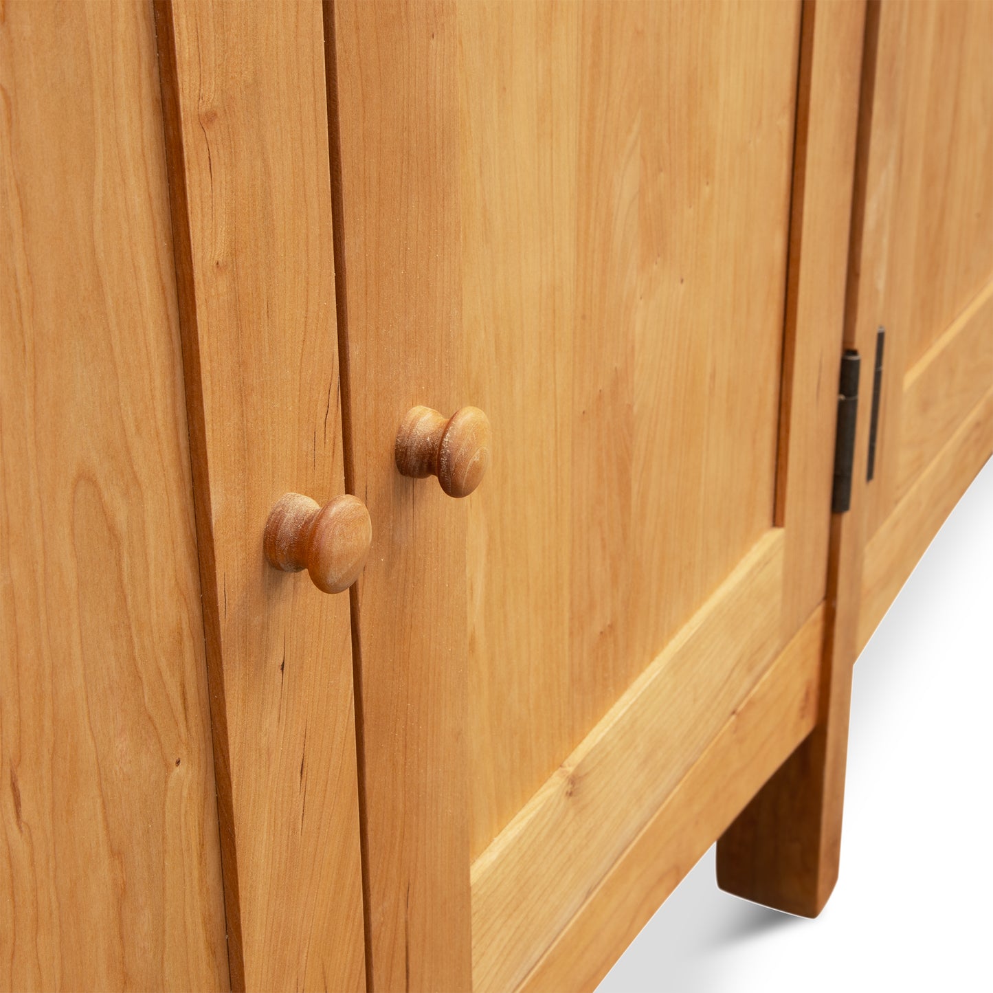 Heartwood Shaker 4-Door Console Bookcase with a natural light finish, showcasing its handcrafted design and quality craftsmanship by Vermont Furniture Designs.
