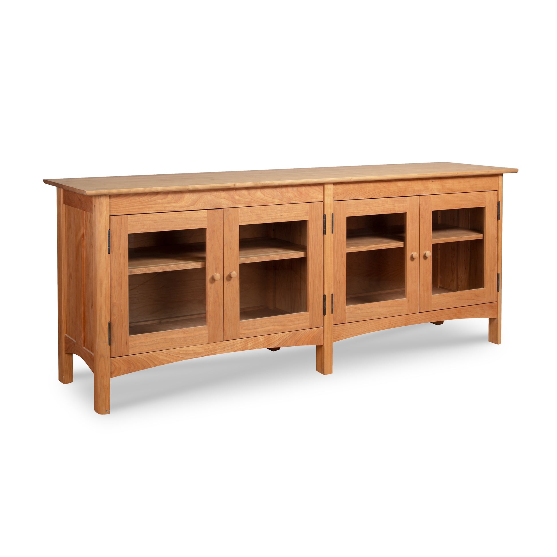 Heartwood Shaker 4-Door Console Bookcase by Vermont Furniture Designs showcasing a light brown finish with glass doors and shelves.