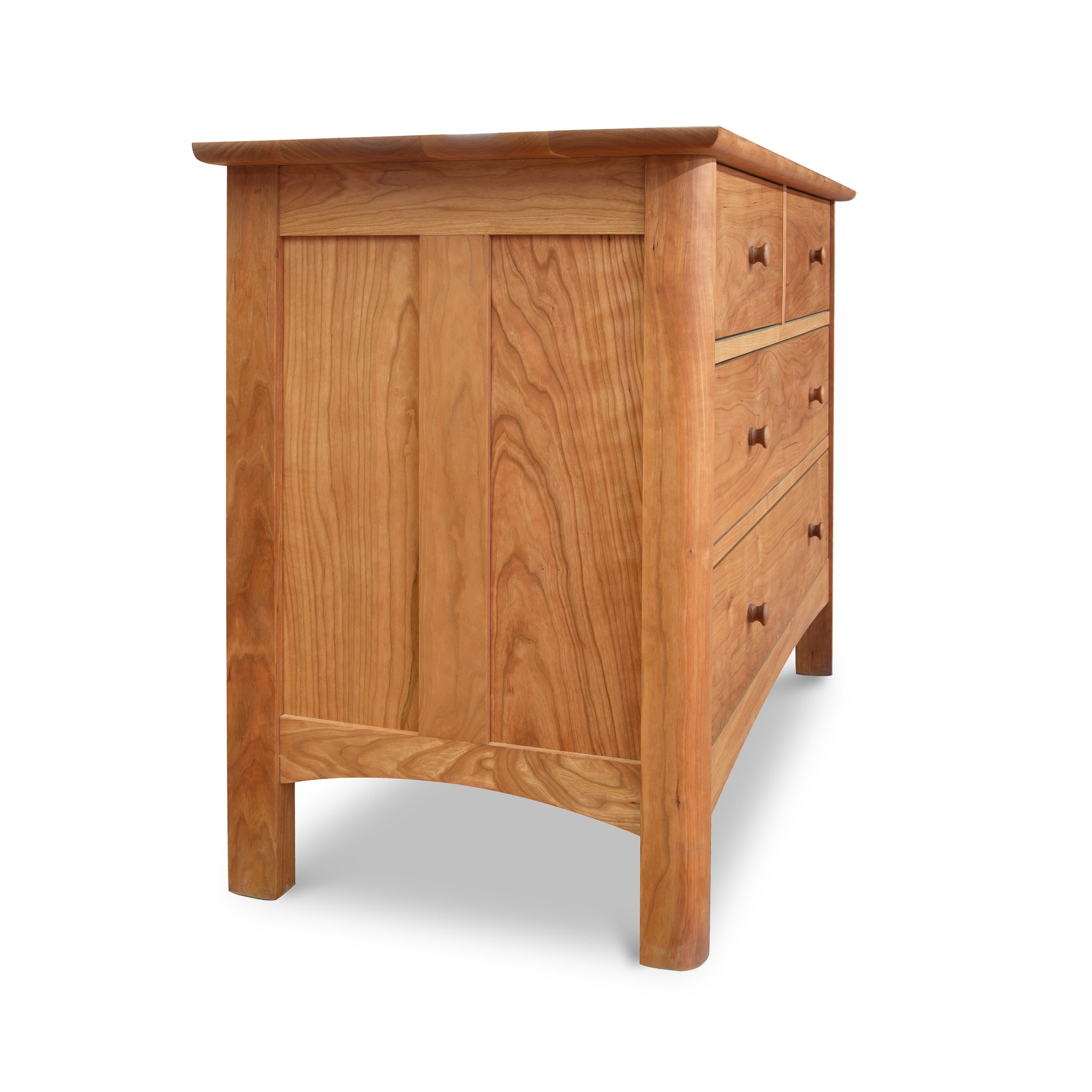 Heartwood Shaker 4-Drawer Dresser by Vermont Furniture Designs, crafted from solid wood with a simple design and visible natural grain, shown from front and side angles.