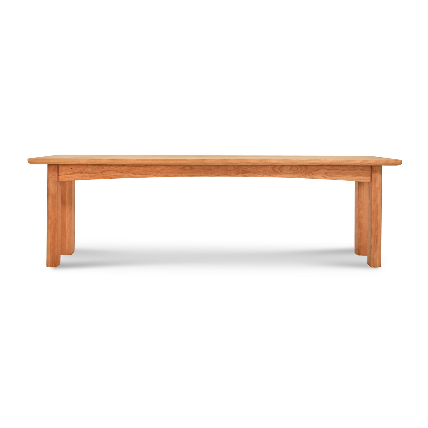 A Heartwood Shaker Bench by Vermont Furniture Designs isolated on a white background.