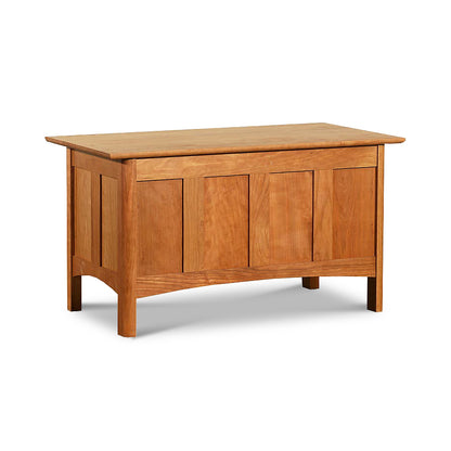 A solid cherry maple walnut Heartwood Shaker Blanket Chest with panel sides and a flat top, isolated on a white background. (Brand Name: Vermont Furniture Designs)