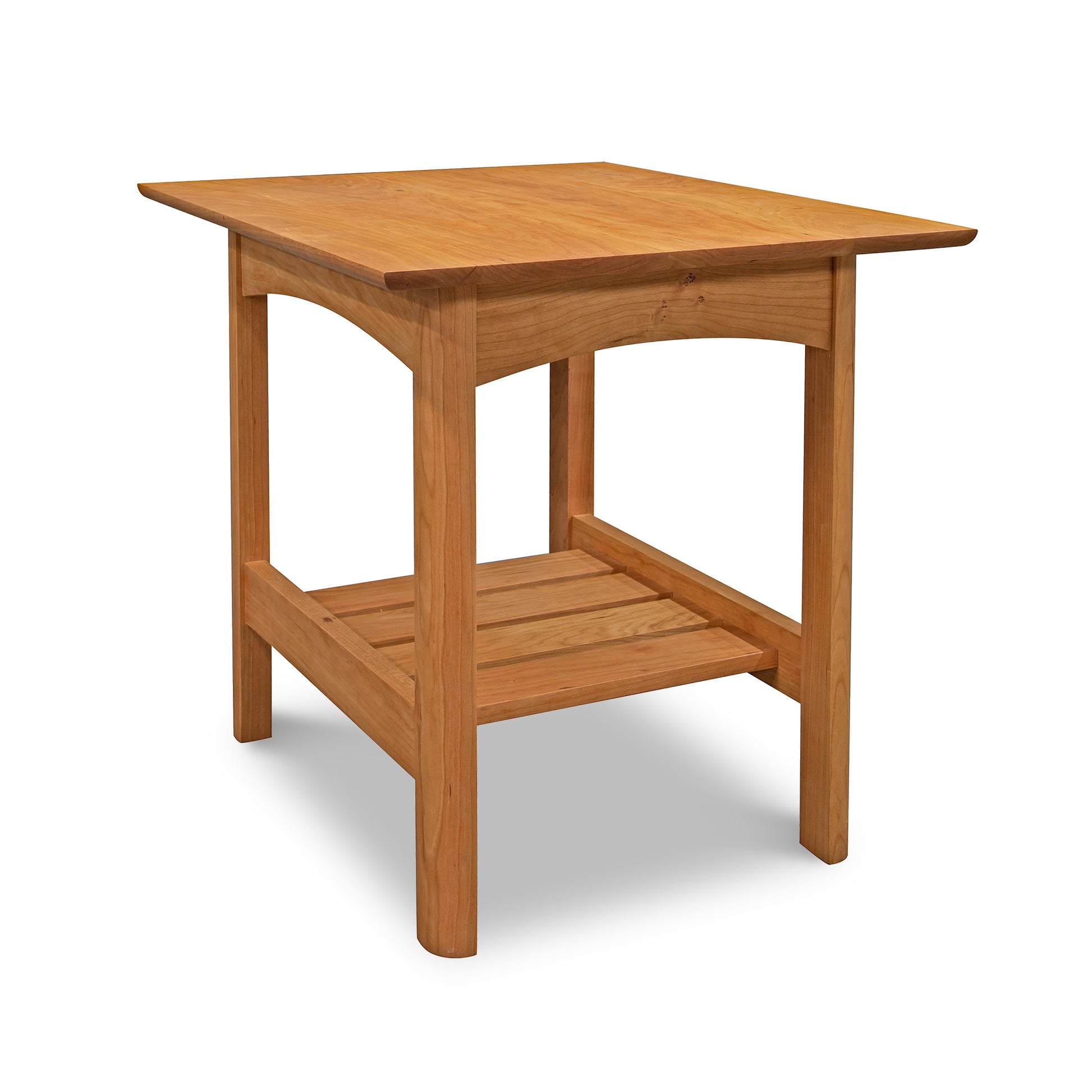 A Heartwood Shaker Lamp Table from Vermont Furniture Designs, with a square top and a lower shelf, isolated on a white background.