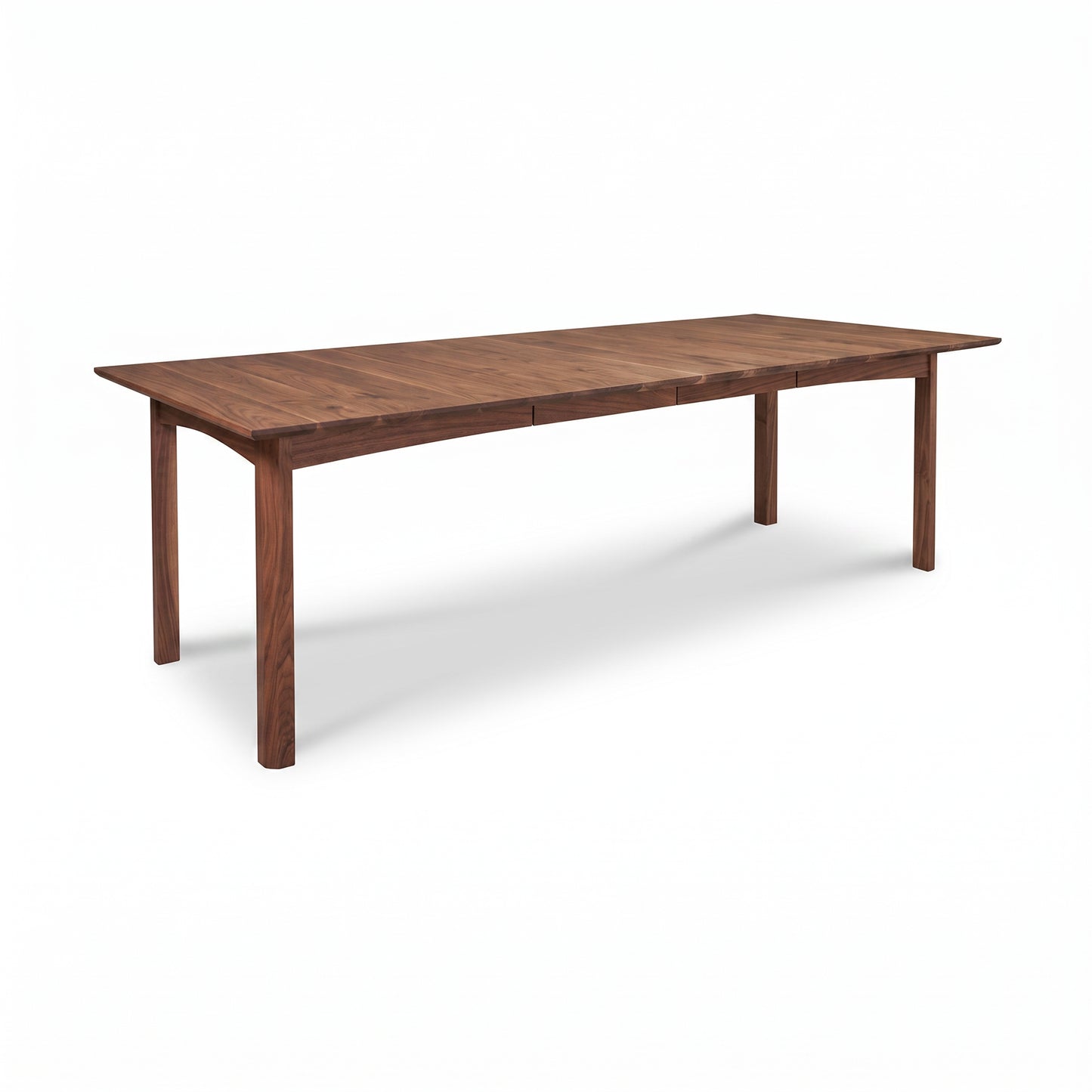Heartwood Shaker Extension Dining Table by Vermont Furniture Designs with four straight legs, crafted in solid wood, shown standalone.