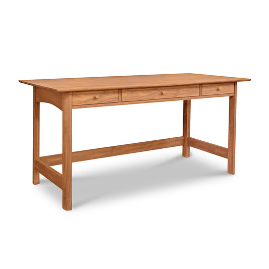 Heartwood Shaker Library Desk by Vermont Furniture Designs with three drawers on a white background.