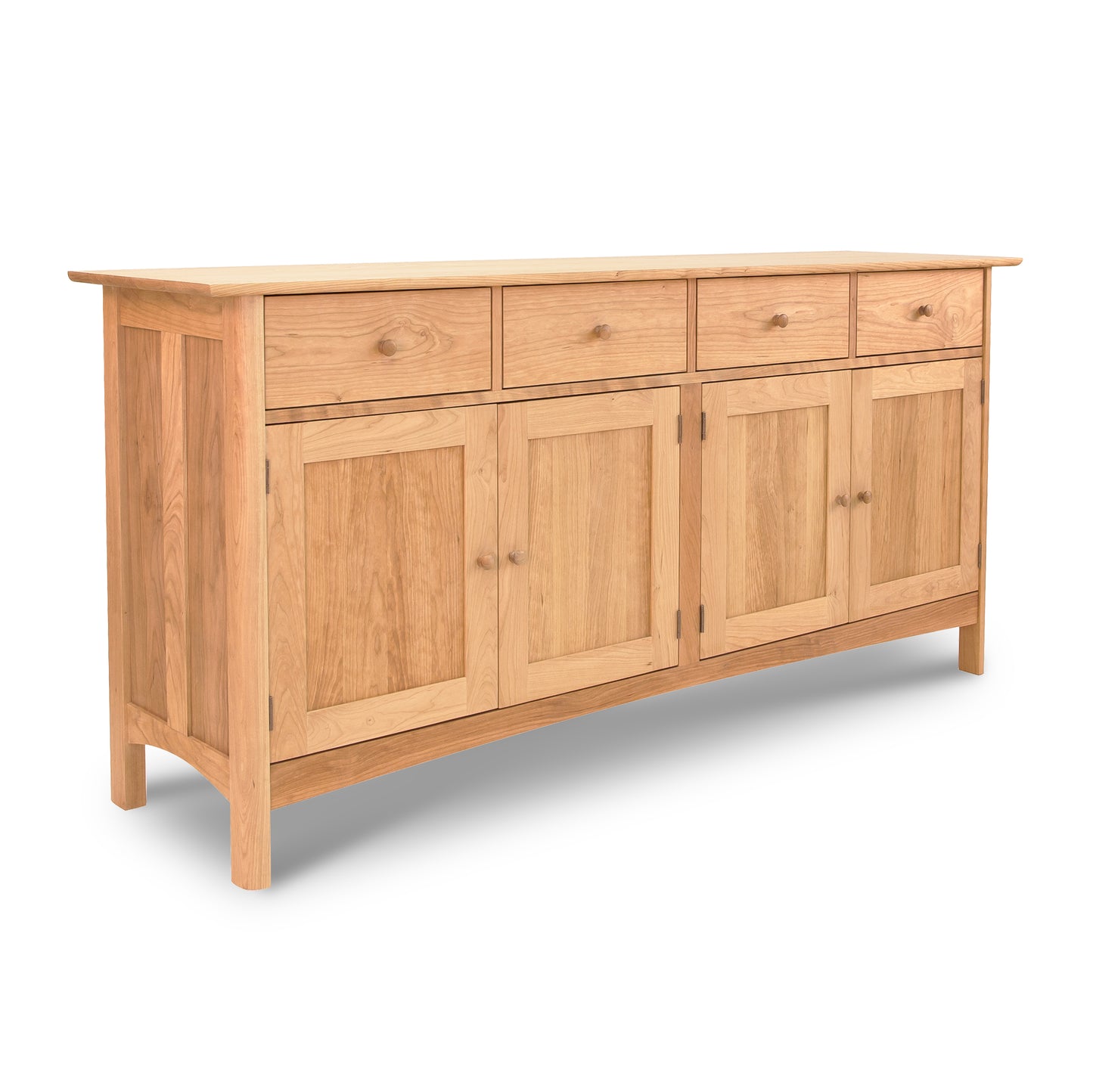 A solid wood Vermont Furniture Designs Heartwood Shaker Long Sideboard cabinet with three drawers and three doors on a white background, featuring an eco-friendly oil finish.