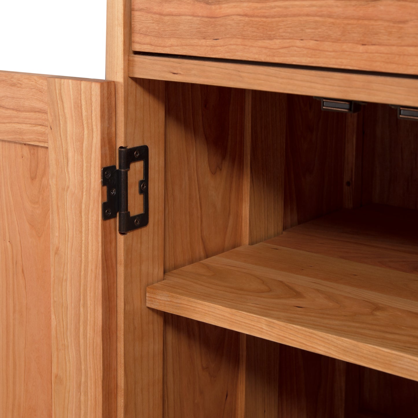 Close-up of a Vermont Furniture Designs Heartwood Shaker Short Storage Chest with an open door revealing the hinges and interior shelves.