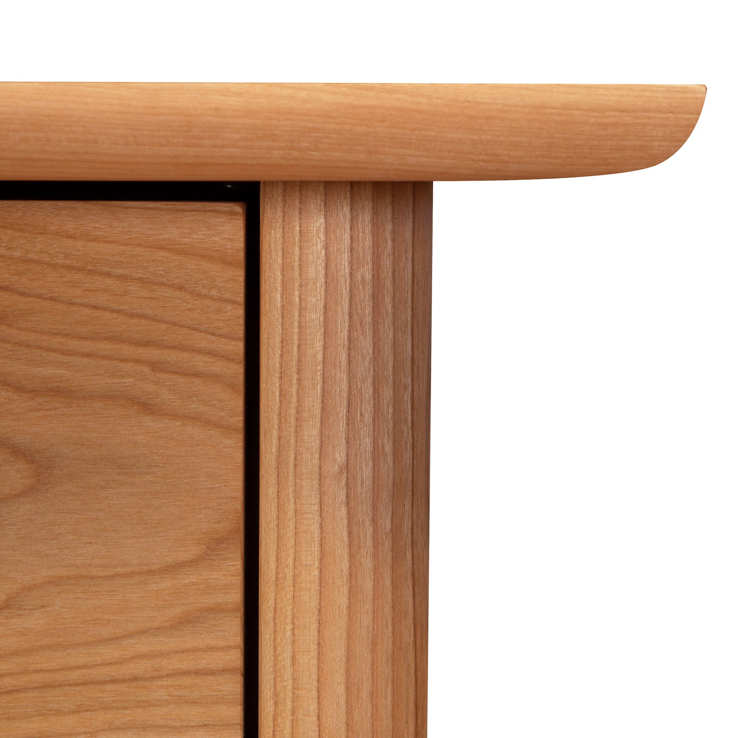 Close-up of a sustainably harvested Vermont Furniture Designs Heartwood Shaker Vertical File Cabinet corner showing the joint between the horizontal and vertical wooden pieces.
