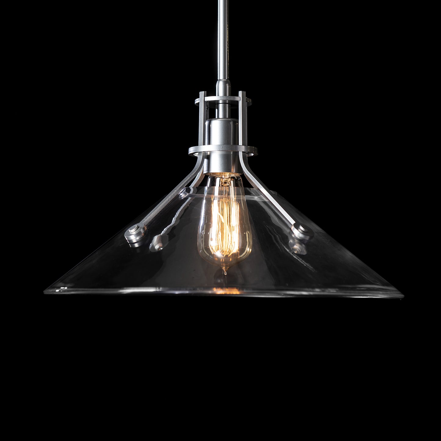 Hubbardton Forge Henry Medium Pendant showcasing contemporary lines and a visible bulb, highlighting its modern design.