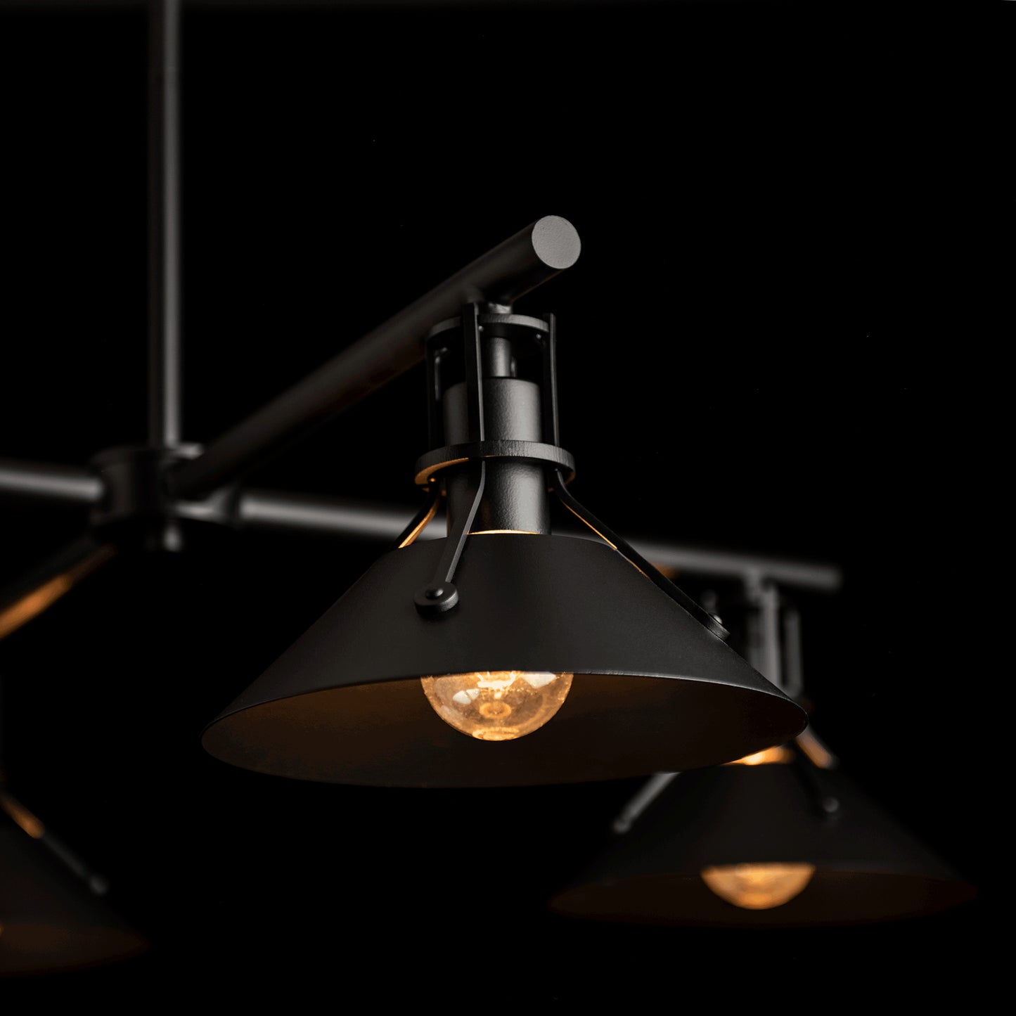 Henry Outdoor 4-Light Pendant by Hubbardton Forge, showcasing exposed bulbs and a modern black finish.