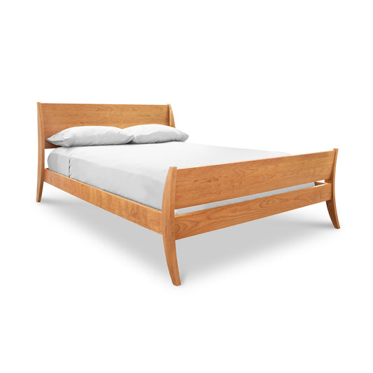 The Lyndon Furniture Holland Sleigh Bed brings a contemporary twist to the traditional wooden bed design, offering solid wood options and a white sheet for added comfort.