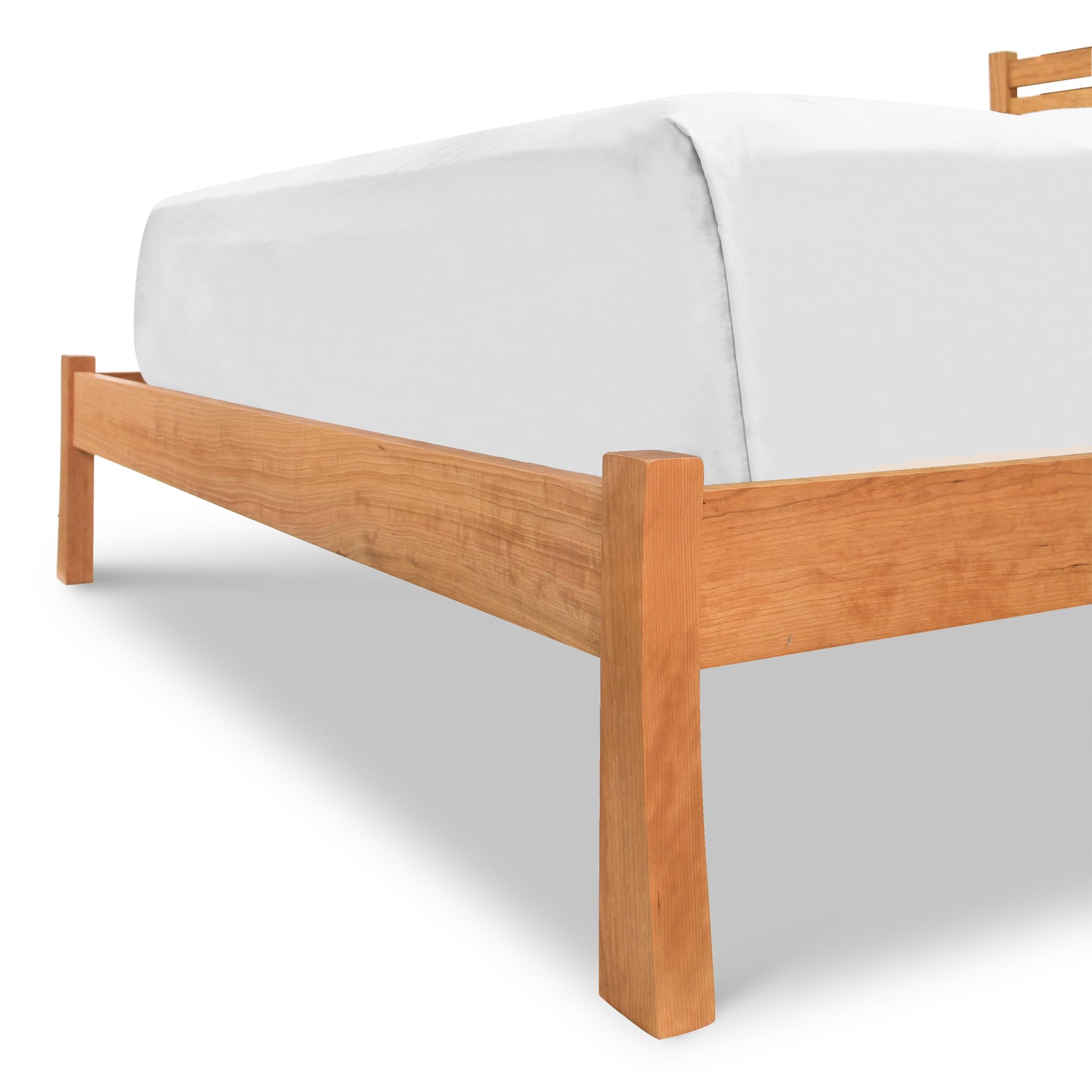 Horizon Platform Bed - Queen in cherry by Vermont Furniture Designs, featuring a white mattress. Focus on bed craftsmanship and wood grain detail.