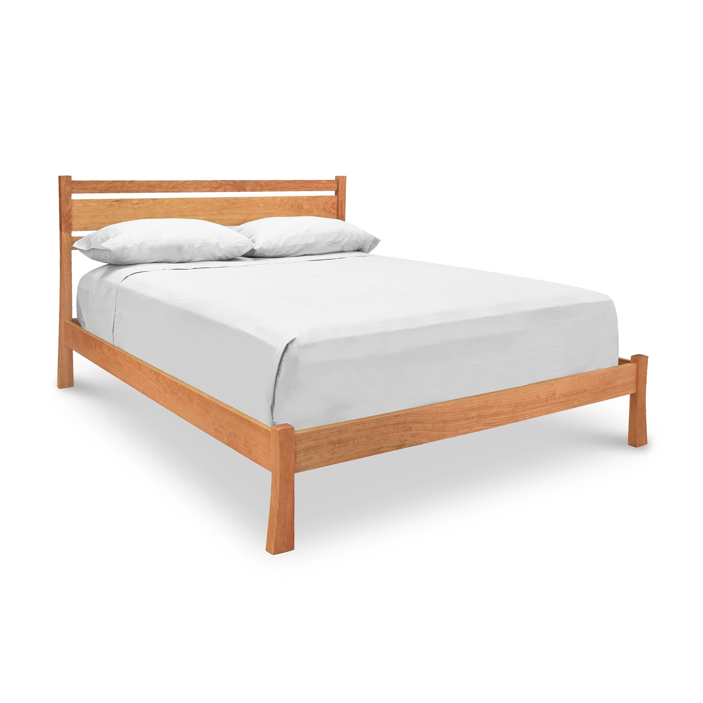 A Vermont Furniture Designs Horizon Platform Bed frame, crafted from eco-friendly oil-finished wood, with a white mattress and two pillows, isolated on a white background.