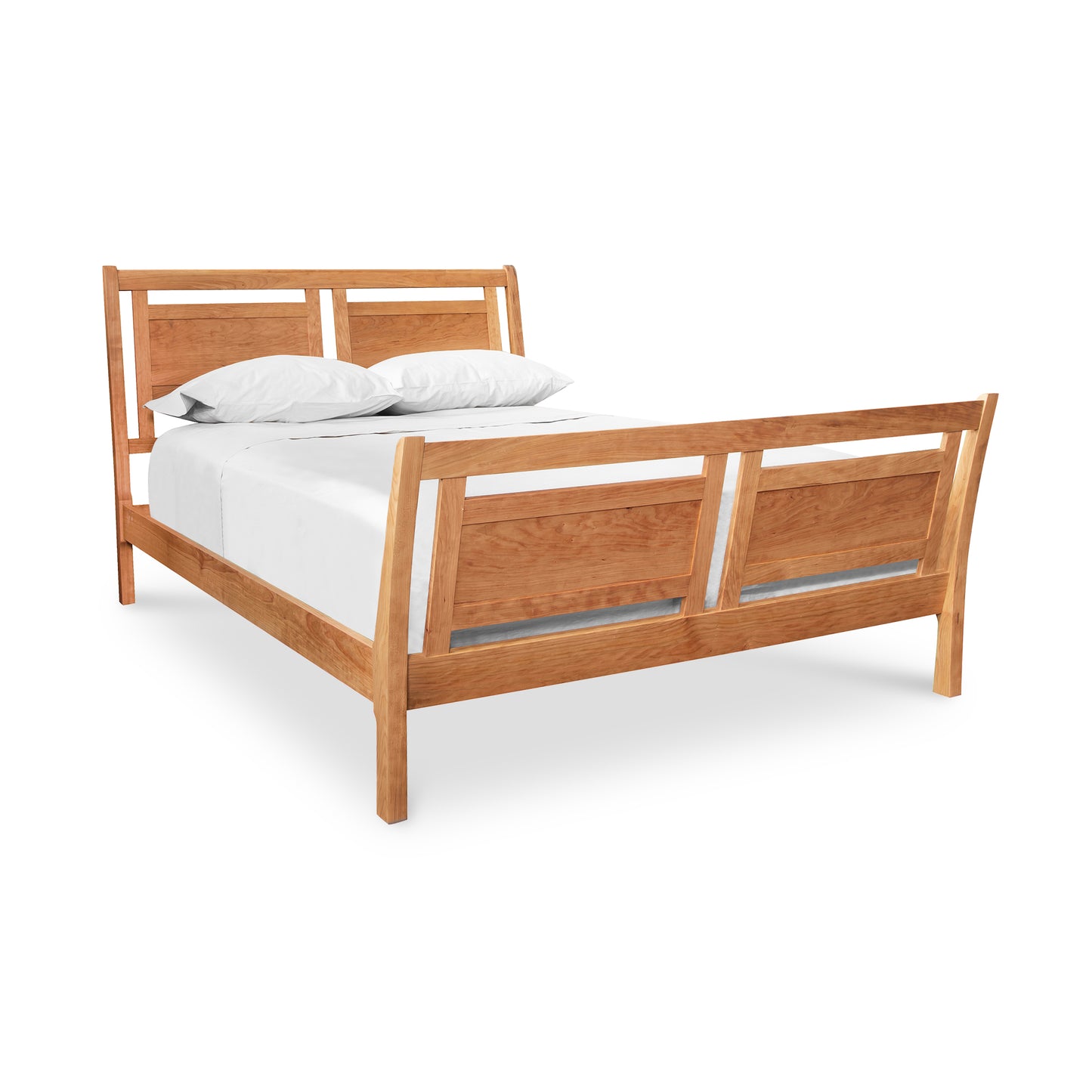 An eco-friendly Incline Sleigh Bed from Vermont Furniture Designs with a white mattress and pillows, isolated on a white background.