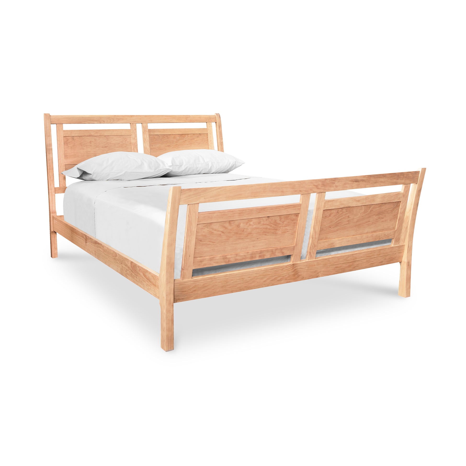 Handcrafted wooden Incline Sleigh Bed featuring detailed headboard and footboard, complemented by a white mattress and pillows.