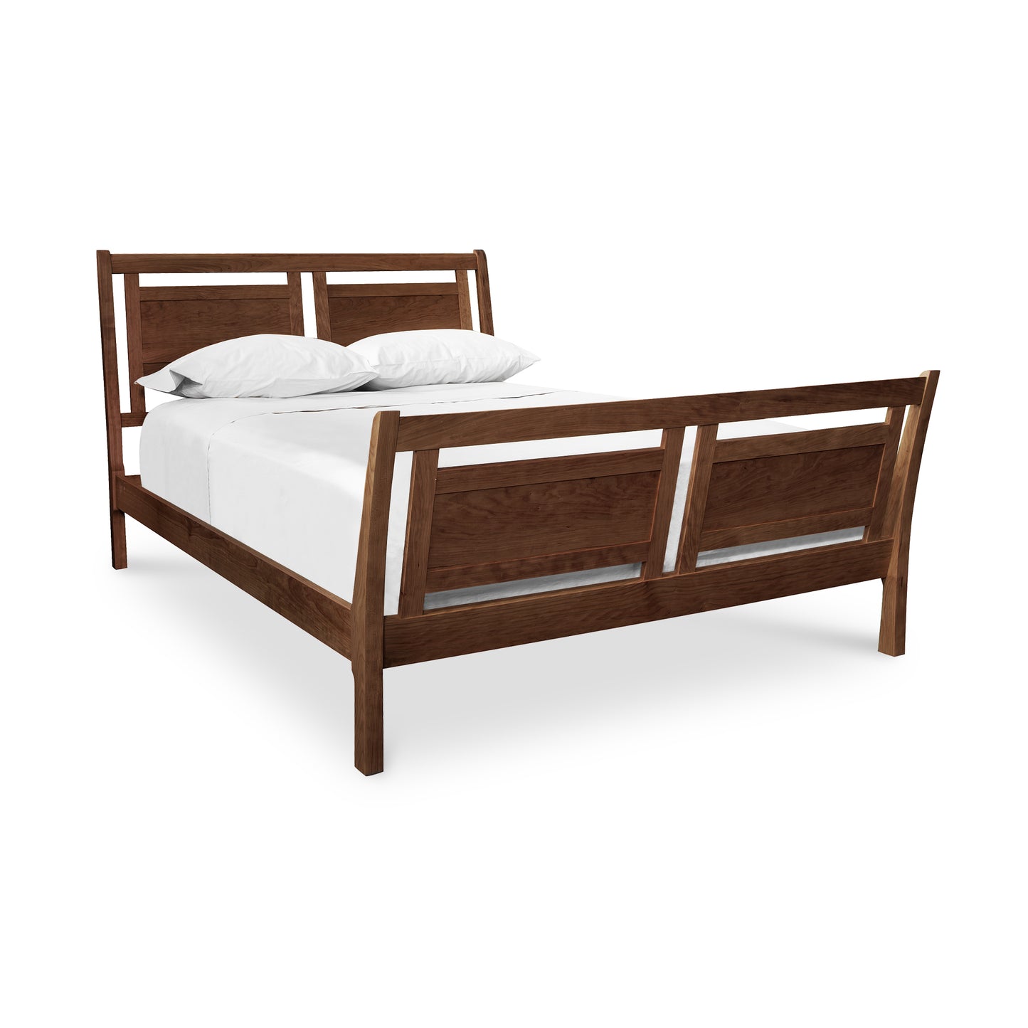 A handcrafted Vermont Furniture Designs Incline Sleigh Bed frame with an eco-friendly white mattress and pillows set against a white background.