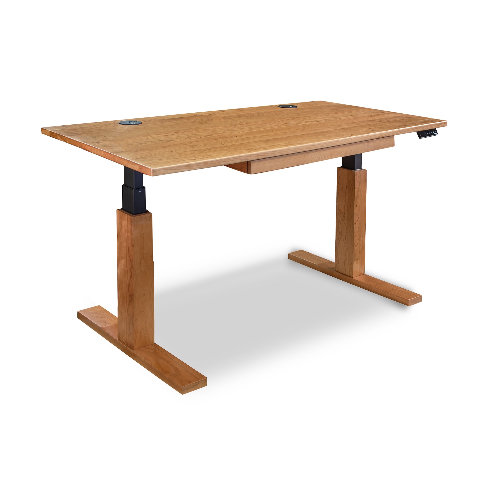 Invigo Sit-Stand Desk by Copeland Furniture with cherry wood top, sturdy T-legs, and ergonomic right-side controls for seamless height adjustment.