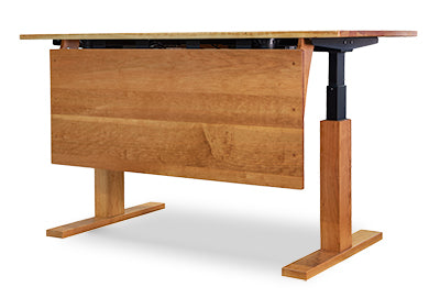 Invigo Sit-Stand Desk by Copeland Furniture with a cherry rectangular top, solid modesty panel, and adjustable black metal legs, handcrafted in Vermont.