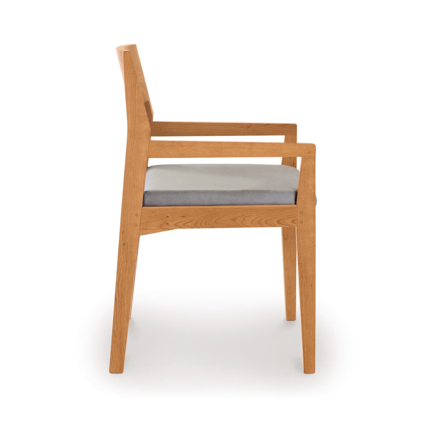 Iso Chair by Copeland Furniture featuring a straight back, armrests, and a light gray cushion in solid cherry wood design.