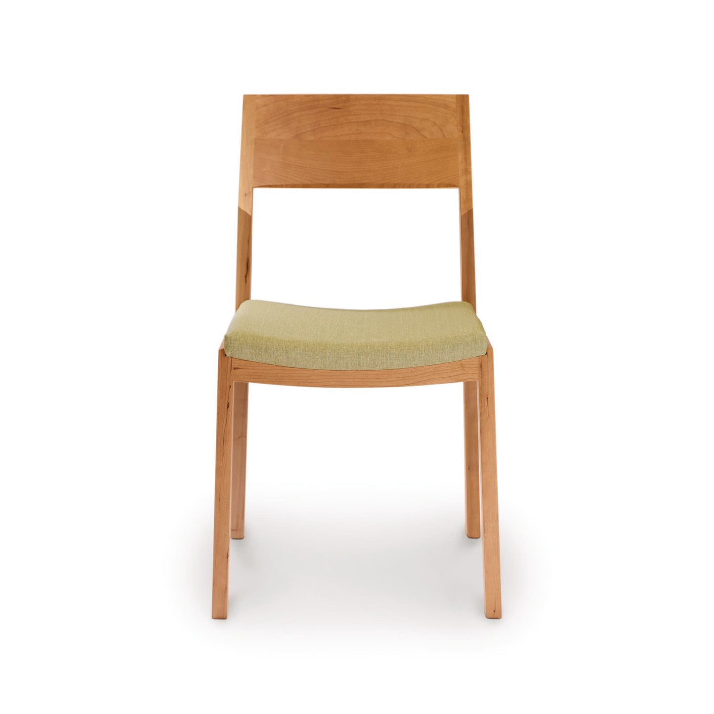 A solid cherry wood Copeland Furniture Iso Chair with a green fabric seat against a white background, crafted from sustainably sourced hardwoods.