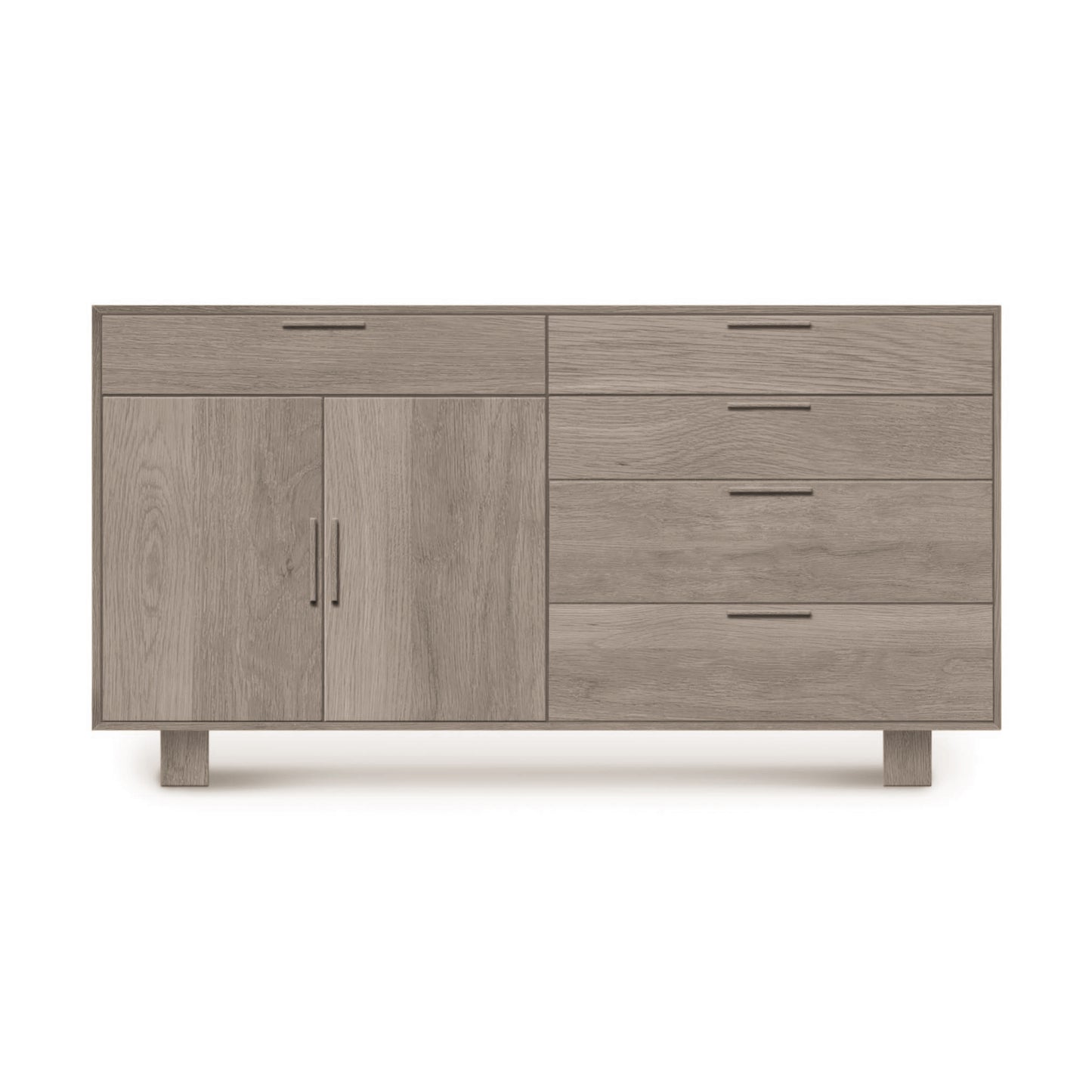 A mid-century modern Iso Oak 2 Door, 5 Drawer Buffet from Copeland Furniture with a combination of drawers and a cabinet door on short legs, isolated against a white background.