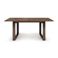 A modern Iso Extension dining table by Copeland Furniture with a simplistic design on a plain white background.