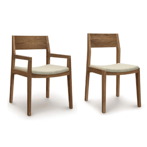 Set of 6 Copeland Furniture Iso Walnut Chairs in sustainable walnut, featuring modern design and light cushions; one chair includes armrests.