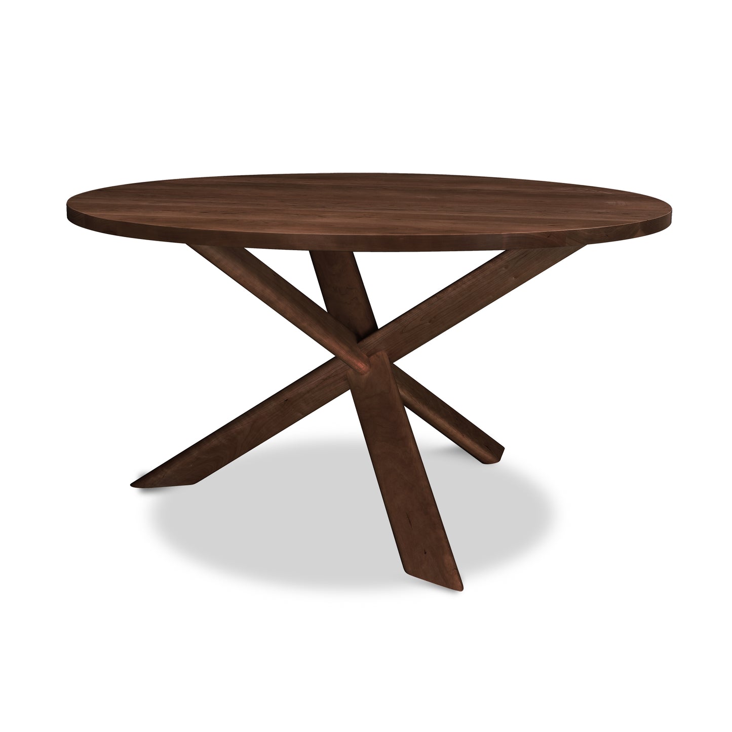 Junction Solid Top Table by Lyndon Furniture with round solid wood top, natural finish, and distinctive three angled legs.
