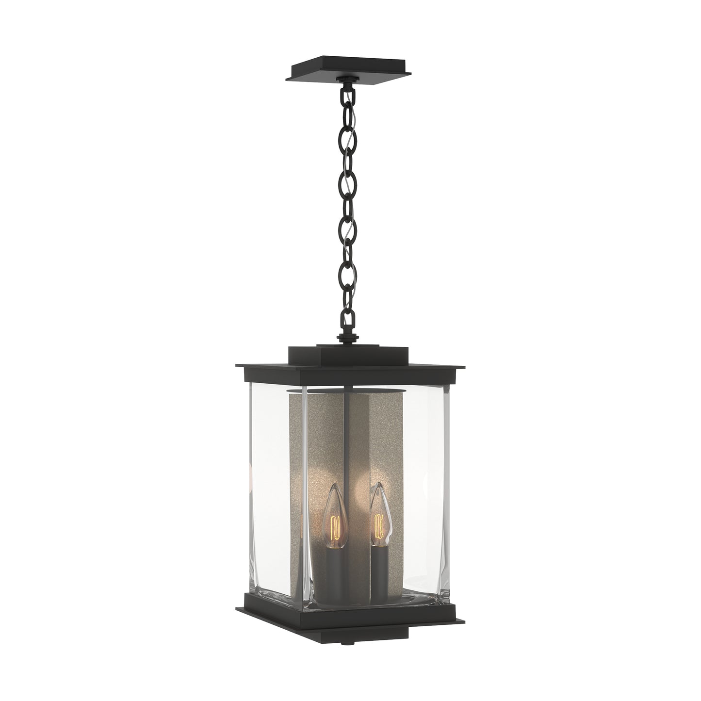 Kingston Outdoor Large Lantern by Hubbardton Forge with black square frame, clear glass panels, and two candle-style bulbs suspended inside.