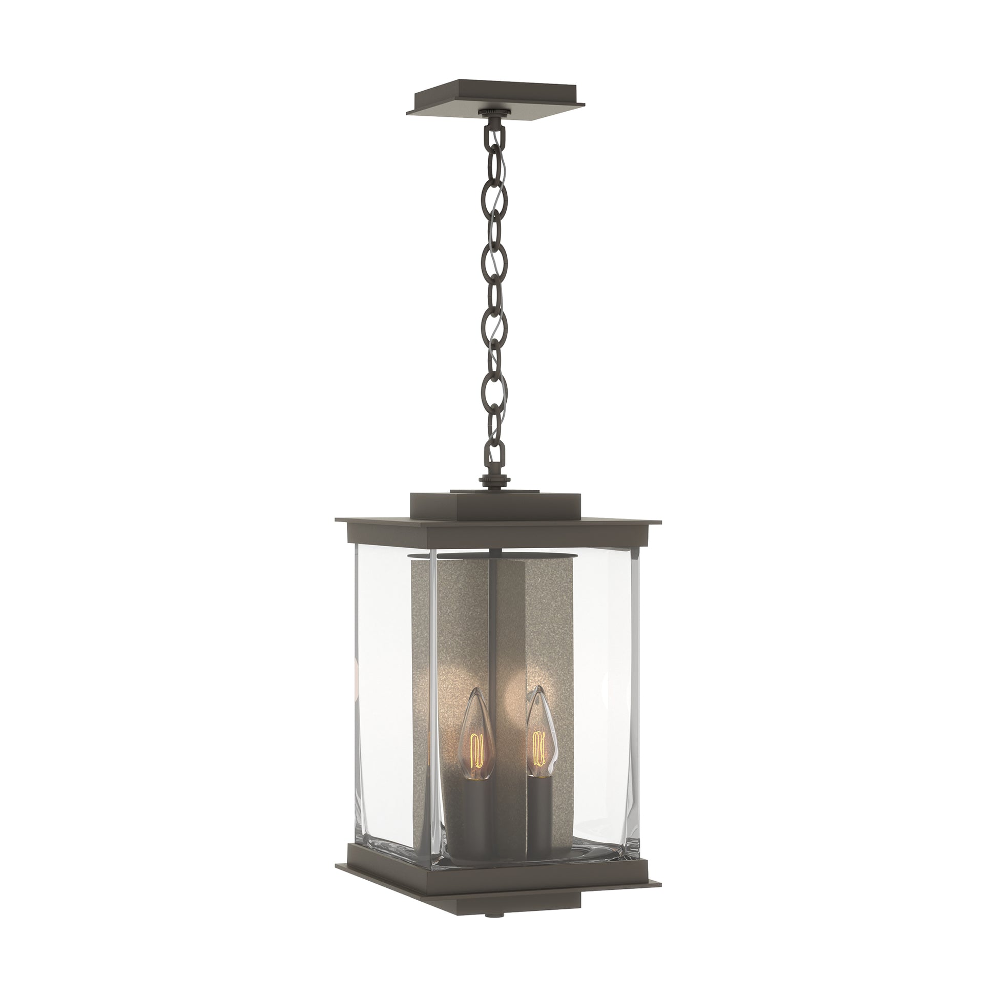 Kingston Outdoor Large Lantern by Hubbardton Forge featuring a Coastal Bronze frame, clear glass panels, and candle-style bulbs.