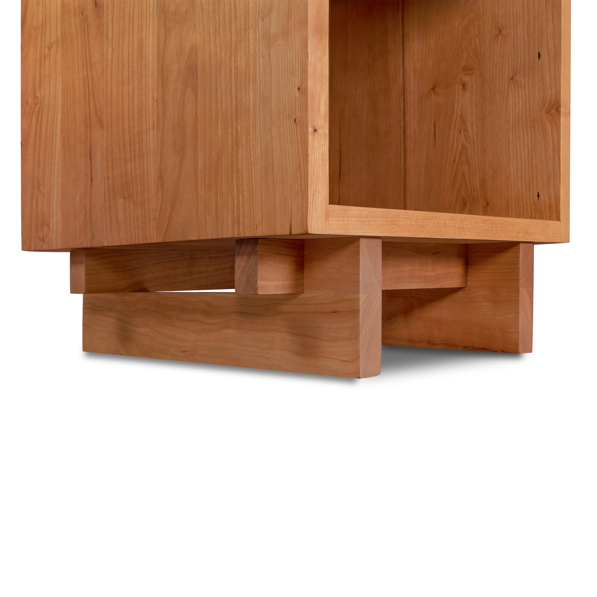 Kipling 1-Drawer Enclosed Shelf Nightstand by Vermont Furniture Designs, showcasing its rectangular base and natural wood grain.