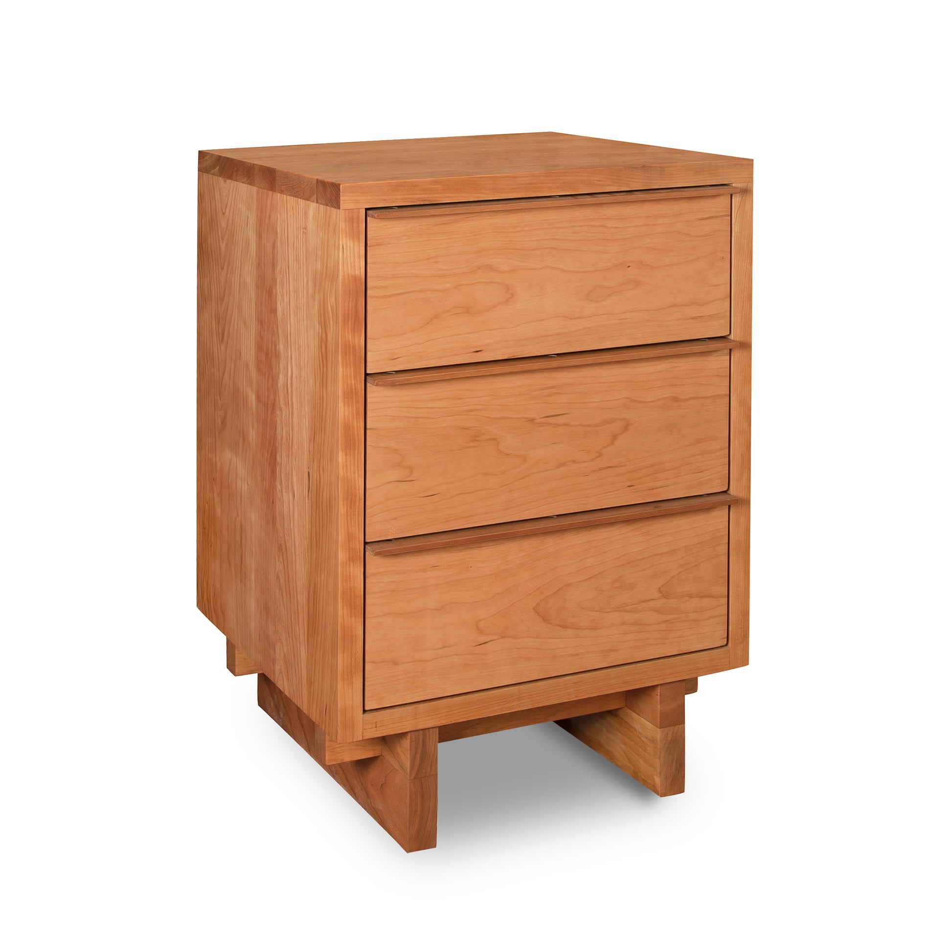 A wooden Vermont Furniture Designs 3-Drawer Nightstand in natural cherry isolated on a white background.