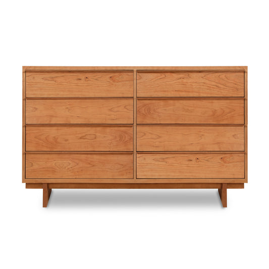 The Vermont Furniture Designs Kipling 8-Drawer Dresser showcases a stylish and timeless design, crafted from wooden materials. This elegant dresser features four spacious drawers, all set against a clean white background.