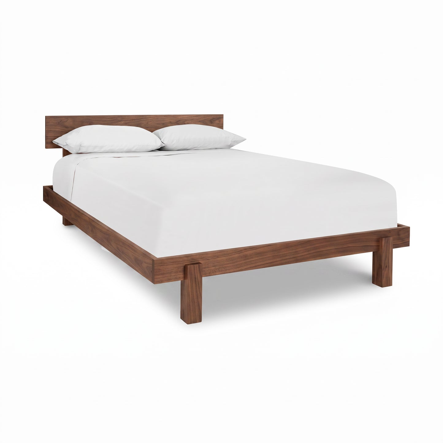 Kipling Bed by Vermont Furniture Designs in solid wood with headboard, dressed in white sheets and pillows. High quality, American made craftsmanship.