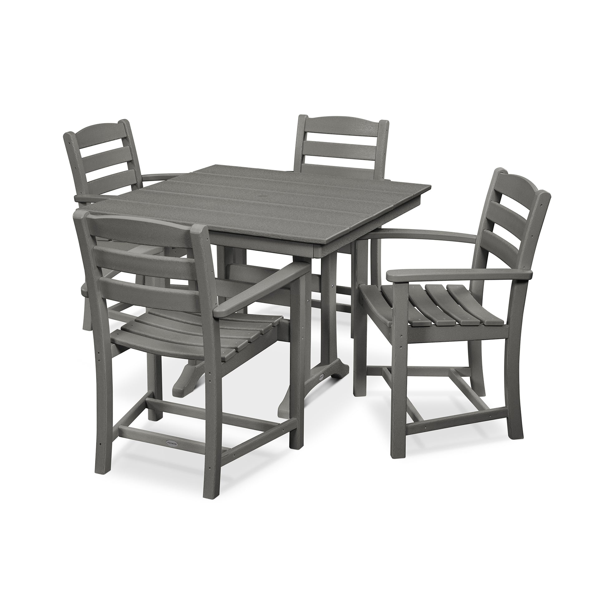 A five-piece outdoor dining set featuring a farmhouse trestle table and four arm chairs, all made of weather-resistant POLYWOOD® lumber, isolated on a white background.