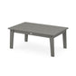 A simple rectangular POLYWOOD Lakeside 23" x 36" coffee table in a solid gray color, featuring a slatted top design and sturdy legs, isolated against a white background.
