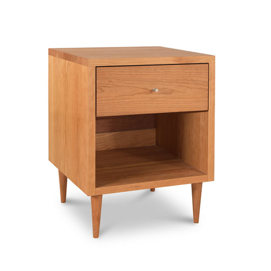 Mid-century modern design Vermont Furniture Designs Larssen 1-Drawer Enclosed Shelf Nightstand, isolated on a white background.