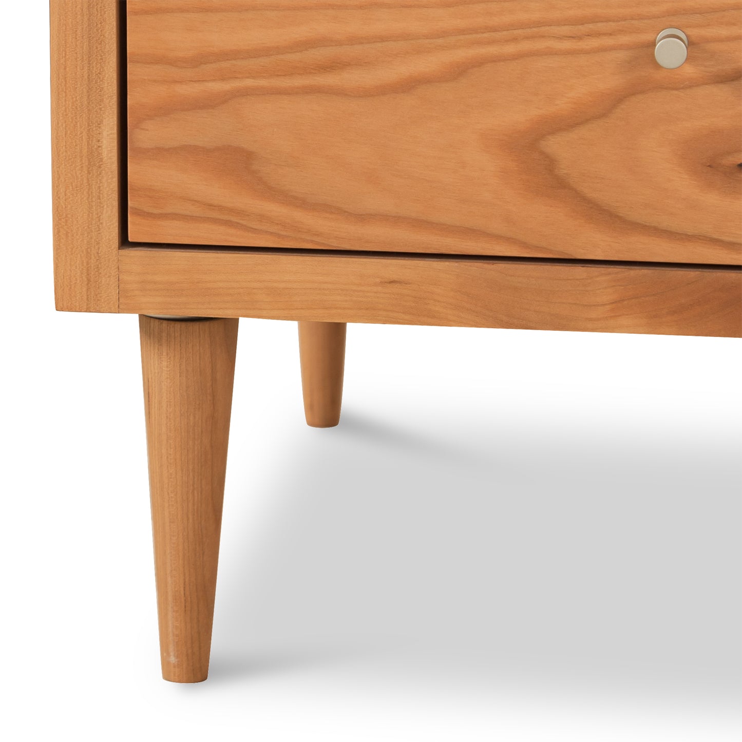 Larssen 3-Drawer Nightstand by Vermont Furniture Designs, highlighting its mid-century tapered legs, metal handle, and hardwood craftsmanship.