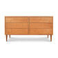 A solid wood construction mid-century modern dresser, named the Vermont Furniture Designs Larssen 6-Drawer Dresser, with six drawers and tapered legs on a white background.
