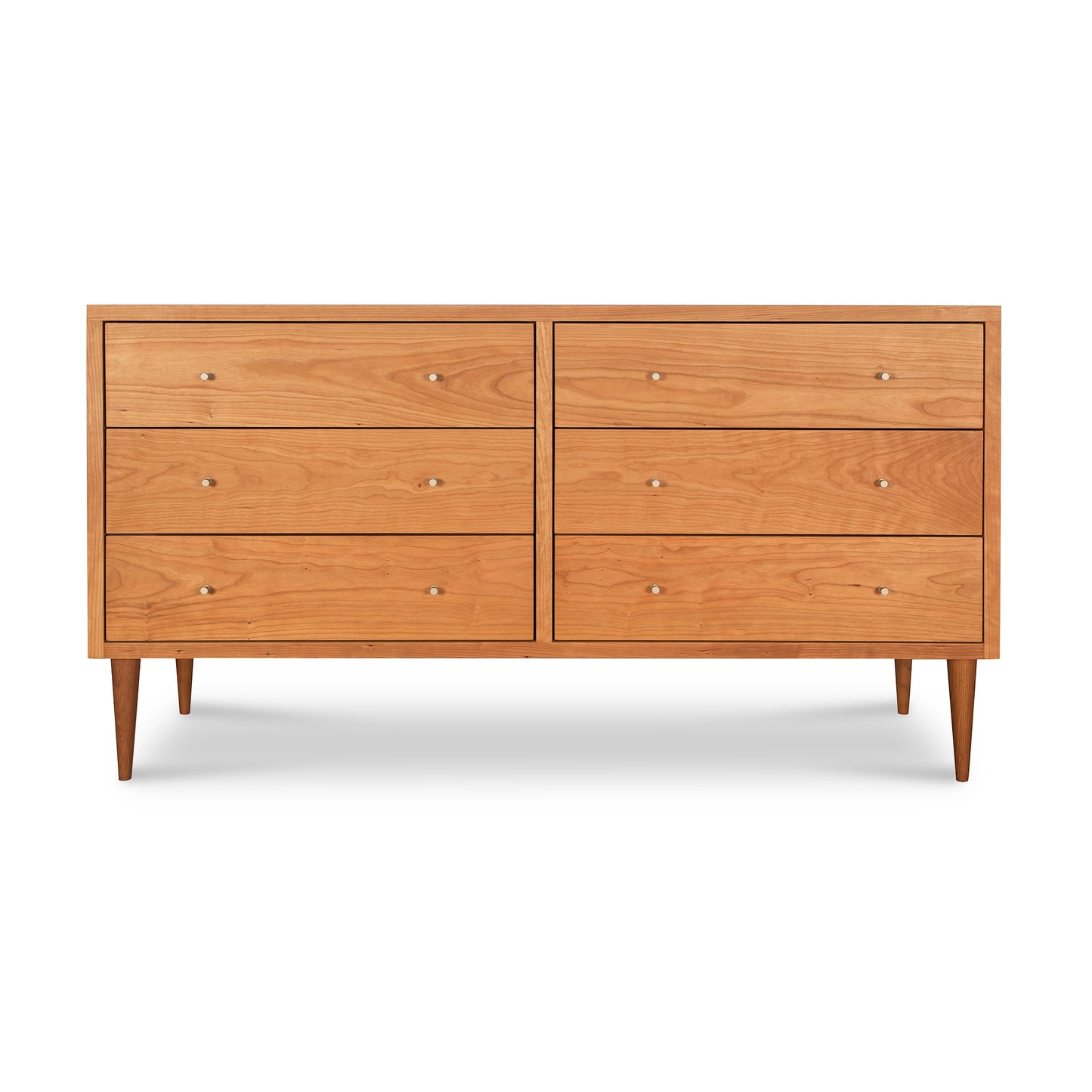 A solid wood construction mid-century modern dresser, named the Vermont Furniture Designs Larssen 6-Drawer Dresser, with six drawers and tapered legs on a white background.