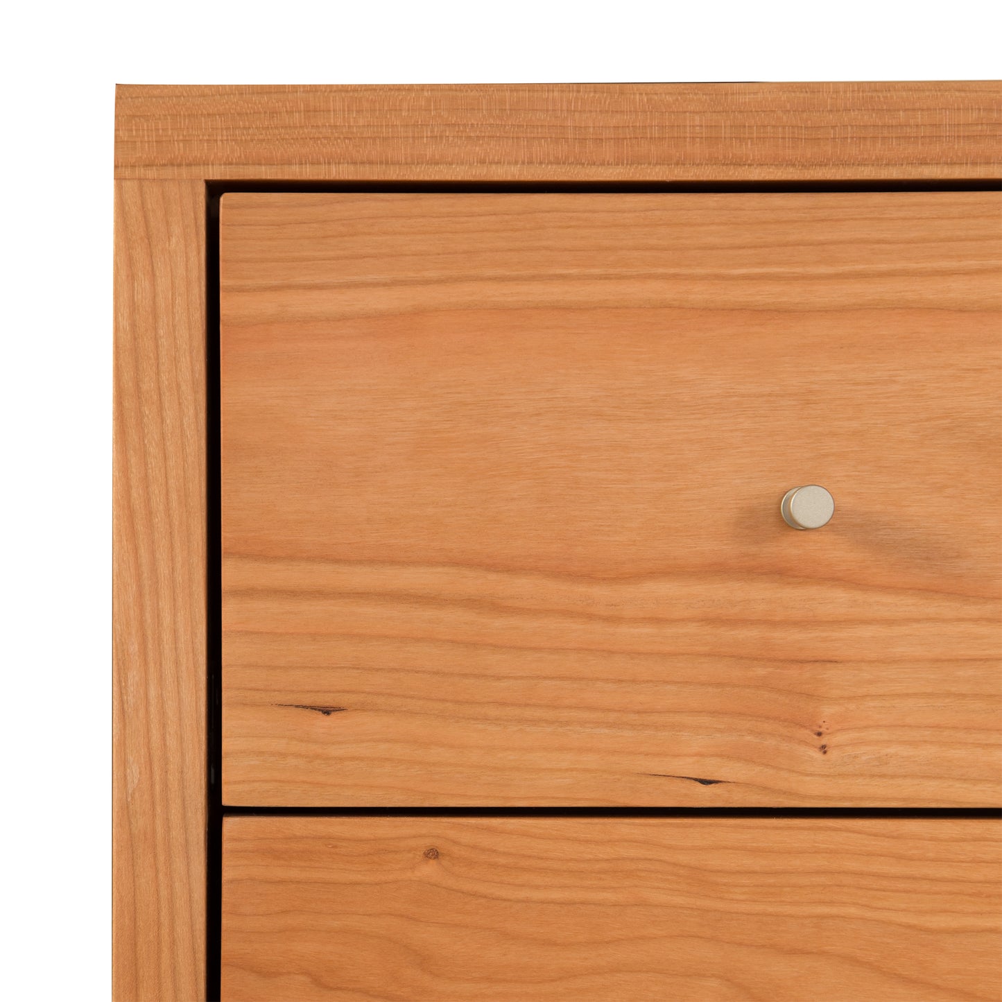 Vermont Furniture Designs Larssen 6-Drawer Dresser close-up, featuring two drawers with round metal knobs and rich wood grain texture.