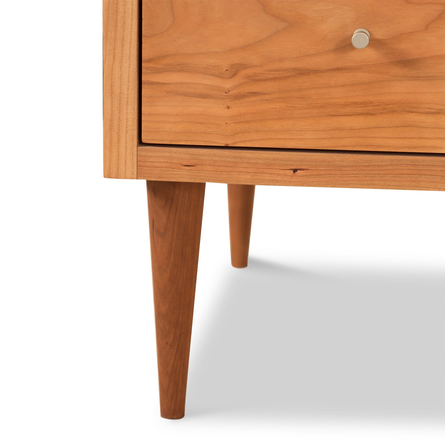 Larssen 6-Drawer Dresser by Vermont Furniture Designs featuring silver knobs and tapered legs, showcased on a neutral background.