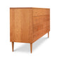 A Larssen 8-Drawer Dresser by Vermont Furniture Designs with a solid wood construction in mid-century modern style on a white background.